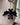 Bat Felt Wool Keychain hanging from a beige textured bag