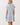 Back view of a Shop Wall printed mini dress with blue floral pattern, flutter sleeves, and a tiered skirt.