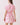 Back view of a model wearing a Shop Wall pink and white floral print A-line mini dress with short sleeves.