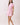 Shop Wall pink and white floral print woven mini dress with collared neckline, button front, and elastic waist.