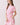 Shop Wall floral print mini dress with collared neckline, button front, and elastic waist on a model